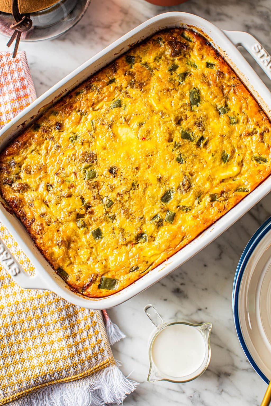 sausage egg breakfast casserole in white ceramic baking dish