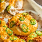 jalapeno cheese pretzels on parchment lined baking sheet