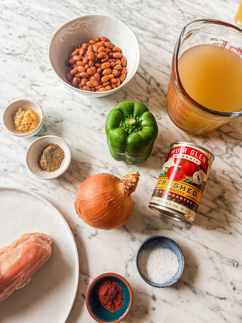 pinto beans, garlic, ground cumin, green bell pepper, brown onion, fire roasted tomatoes, chicken stock, chicken breast, kosher salt, chili powder