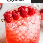 vodka champagne cocktail recipe in glass garnished with raspberries on gold skewer