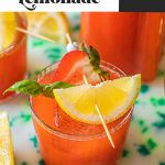 strawberry basil lemonade garnished with strawberry and fresh lemon wedge