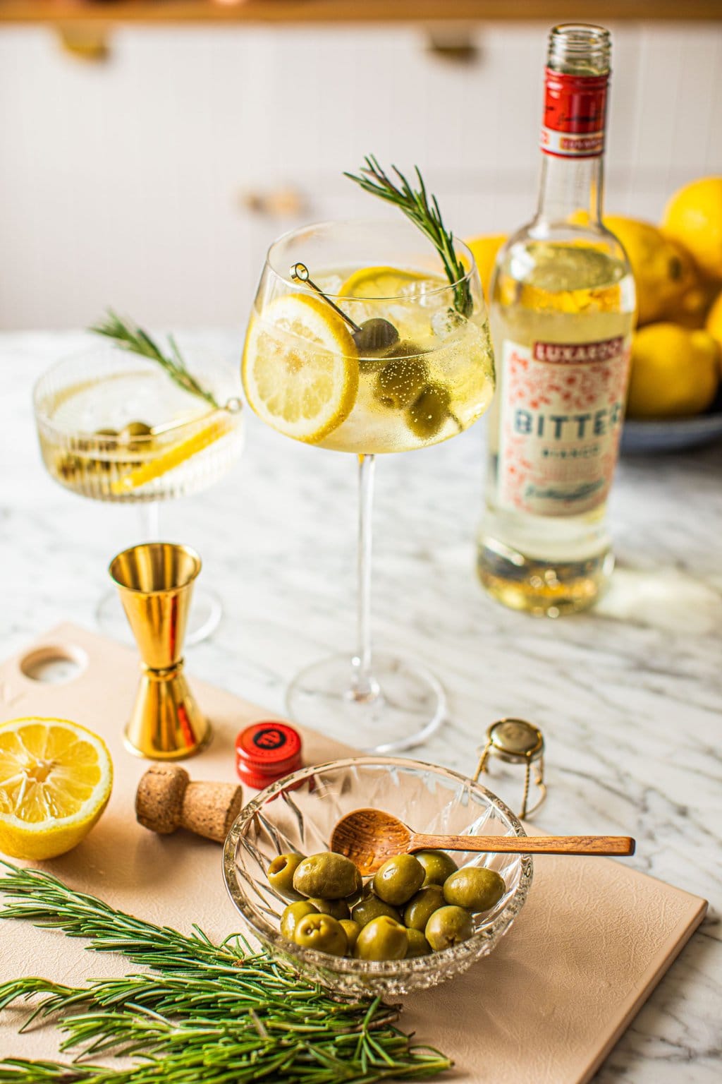 spritz bianco in wine glass with bottle of Luxardo bitter bianco