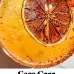 cara cara margarita with a slice of orange garnishing it