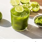 matcha margarita garnished with a slice of lime with text overlay at the bottom