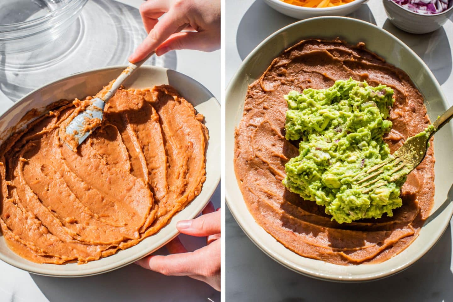 spreading the refried bean layer into a white serving dish and then adding the guacamole on top