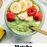 a bowl of matcha chia seed pudding with bananas and raspberries on top