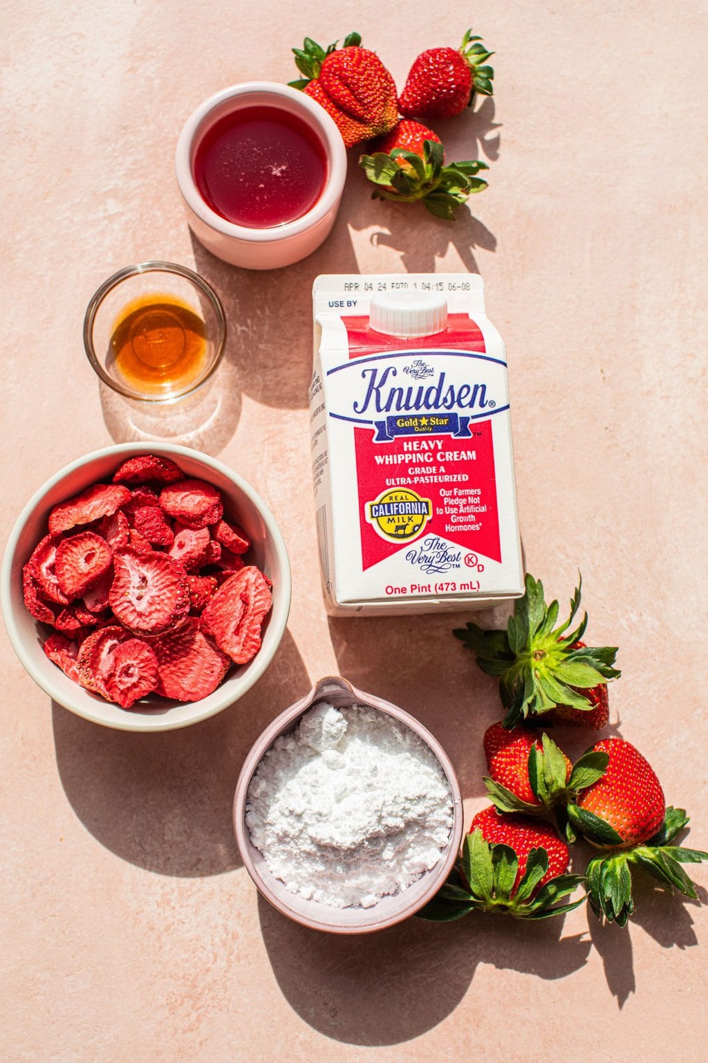 heavy whipping cream, strawberry simple syrup, freeze-dried strawberries, powdered sugar, vanilla