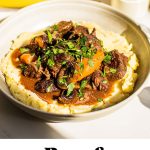 a bowl full of mashed potatoes topped with Julia Child's beef bourguignon