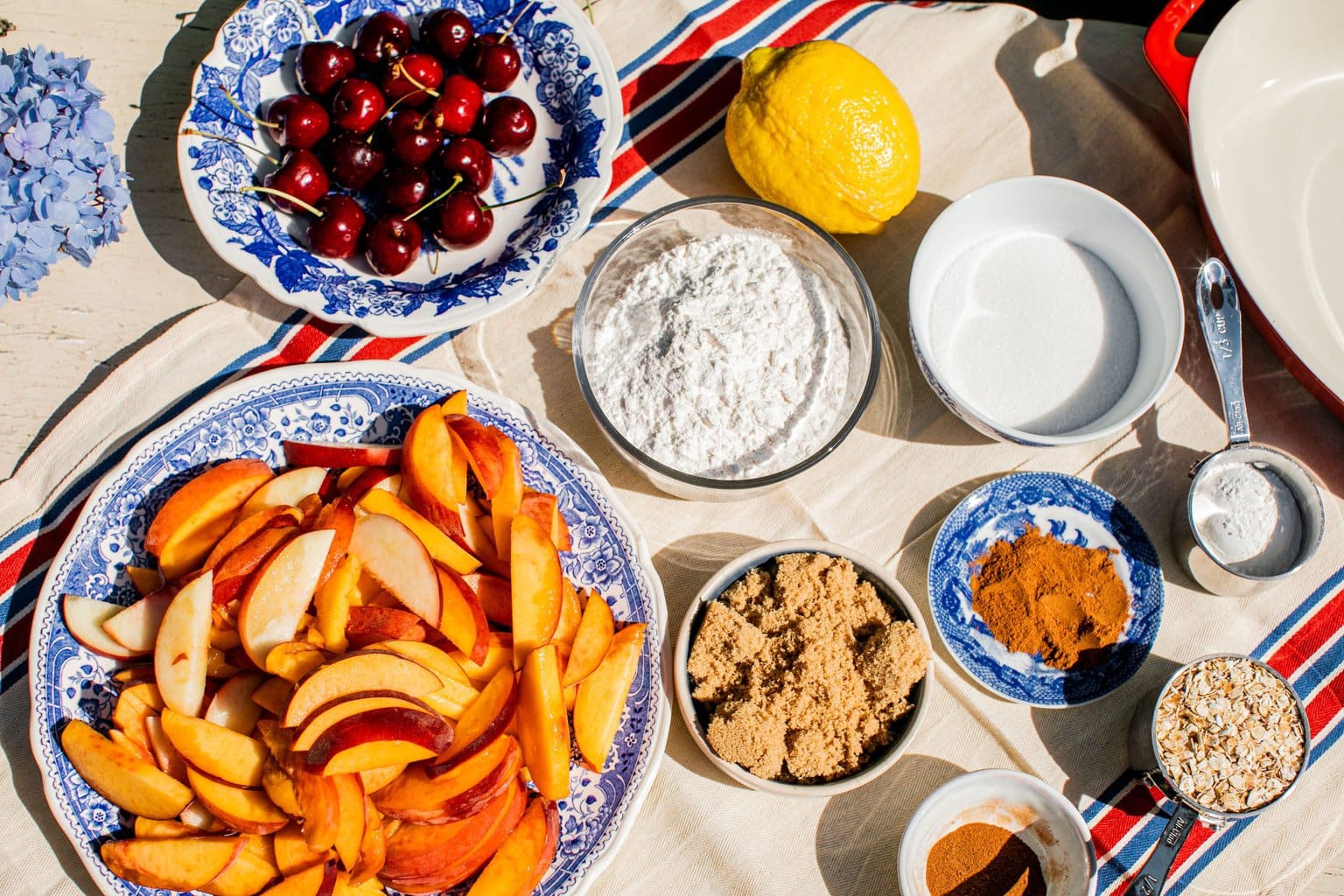 peaches, cherries, flour, lemon, cinnamon, brown sugar, oats, salt, and sugar