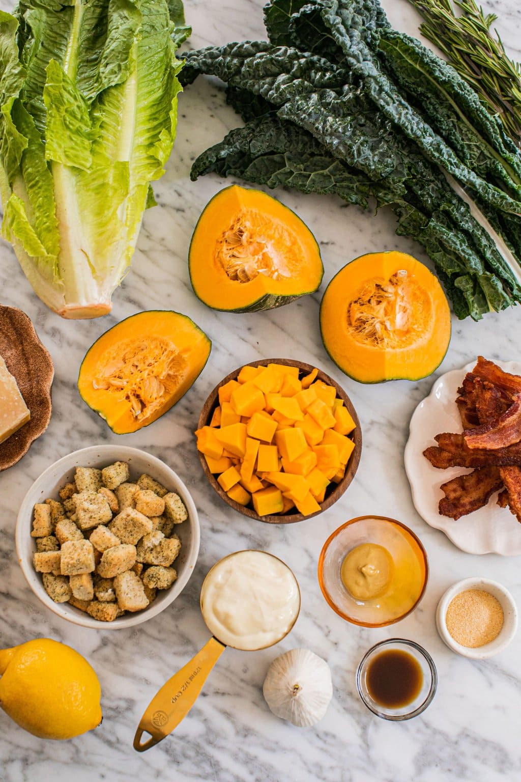 kale, romaine, butternut squash, bacon, parmesan, croutons, and the ingredients to make homemade dressing