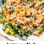 a large platter of kale caesar salad with autumn kale caesar salad text overlay