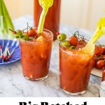 two bloody mary's with garnish and text overlay at the bottom of the photo