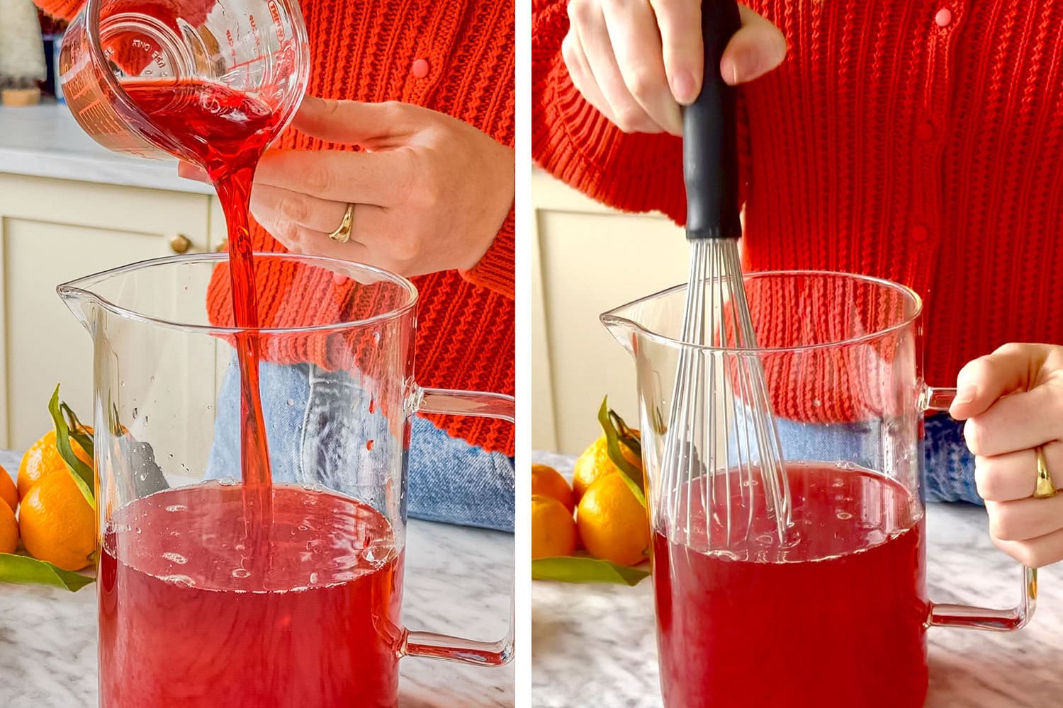 cranberry juice added to a large clear pitcher, a black whisk whisking the liquid in the large clear pitcher 