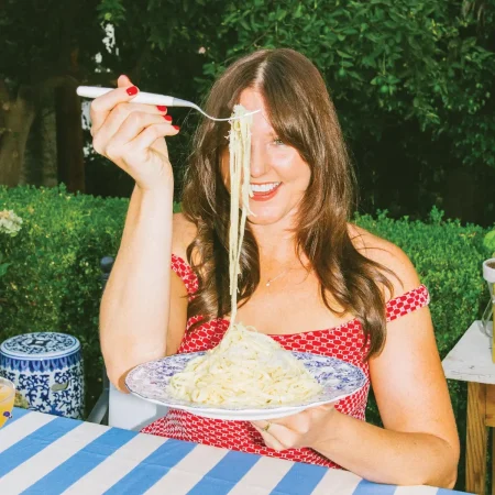 Elizabeth, author of Everyday Elizabeth, eating pasta.