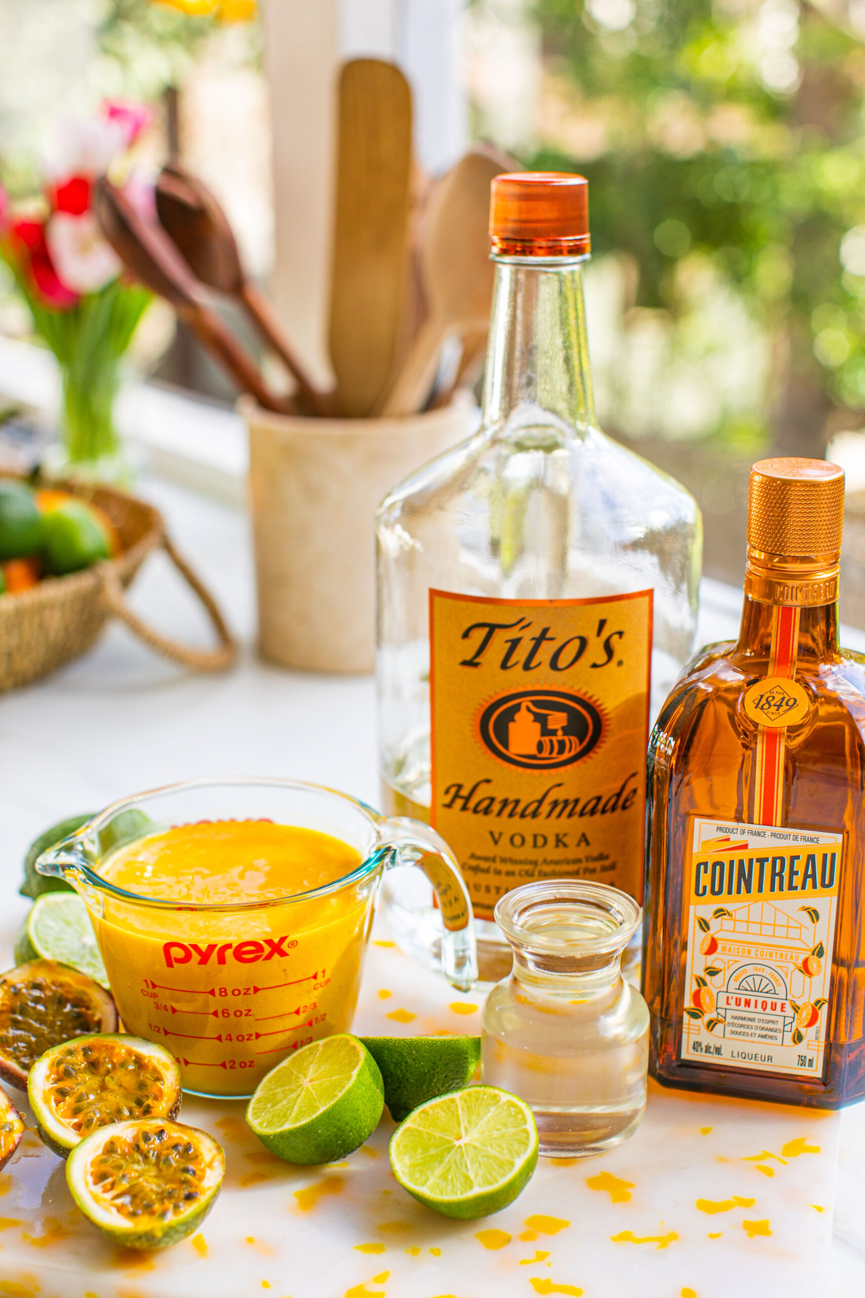 titos, cointreau, limes, passion fruit, passion fruit puree, and simple syrup