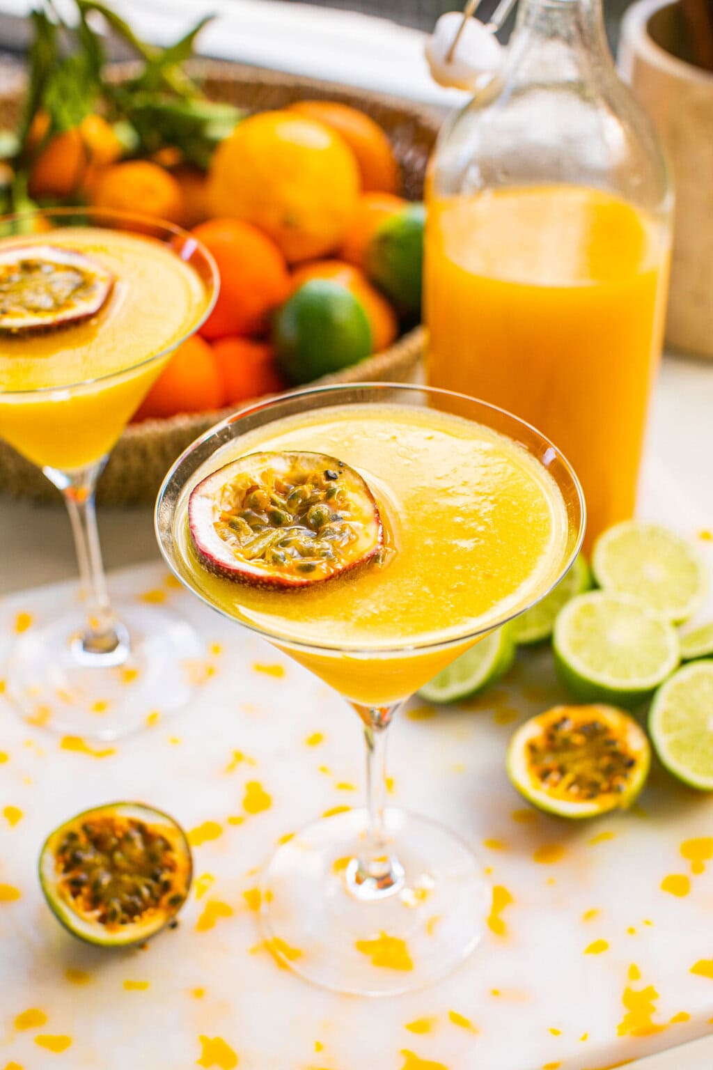 a martini glass full of batched passion fruit martini