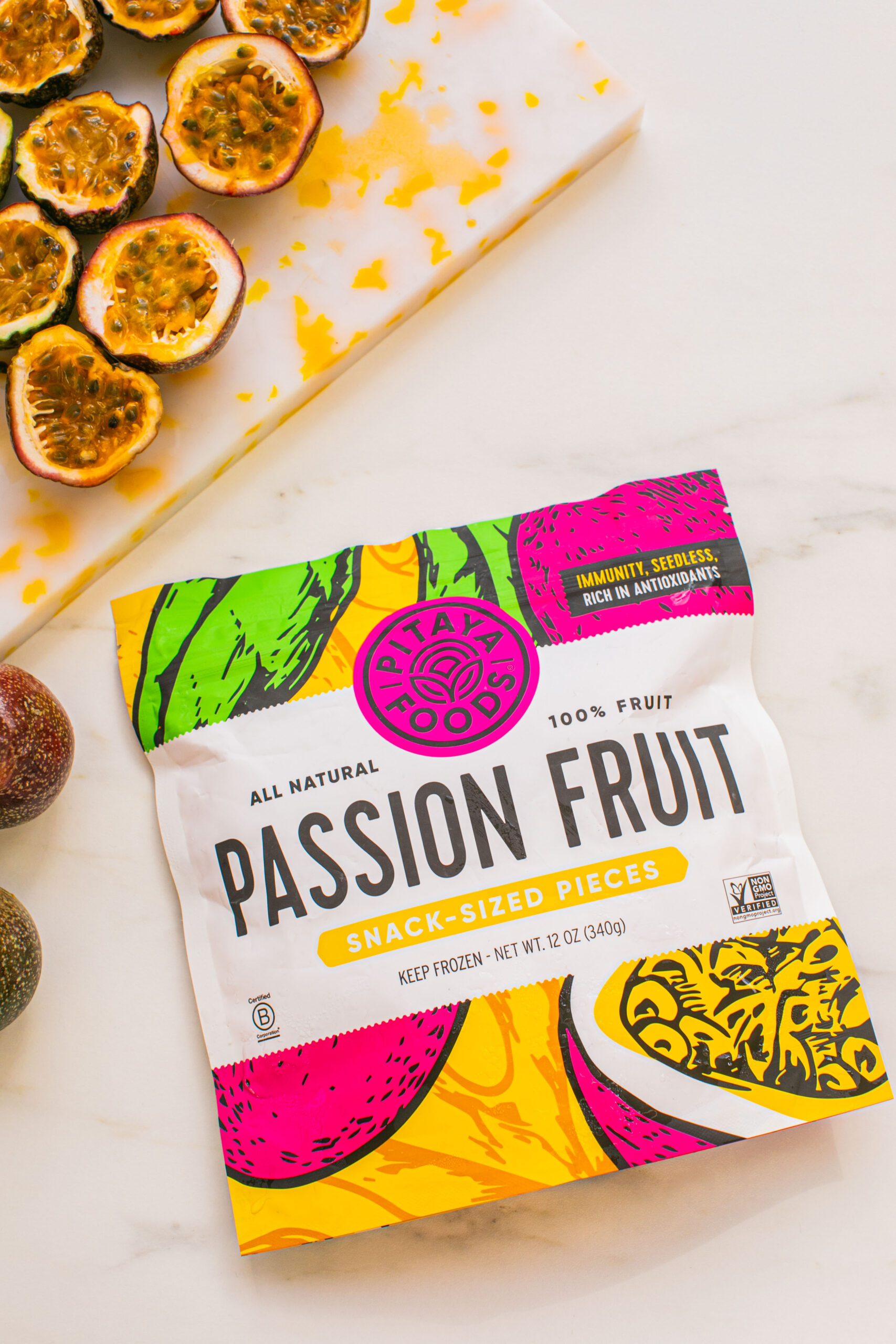 a flat lay picturing pitaya foods snack sized pieces of passion fruit