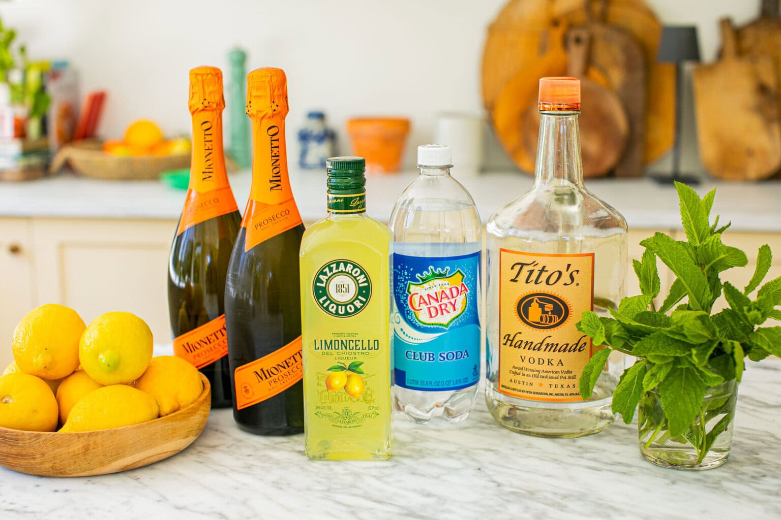 vodka, limoncello, prosecco, soda water, lemons, mint leaves