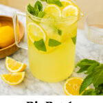 a large pitcher of limoncello spritz with mint leaves and lemon slices for garnish and text overlay on the bottom of the photo with the title