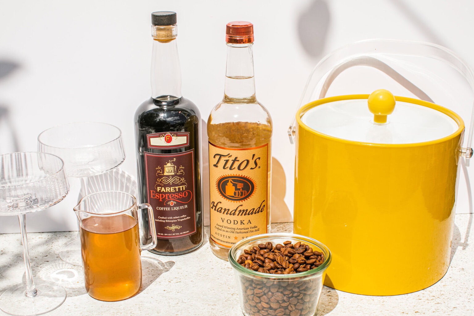 titos, espresso liqueur, ice bucket, espresso beans, and simple syrup