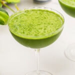 a matcha martini on a white counter