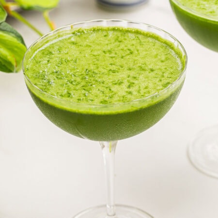 a matcha martini on a white counter