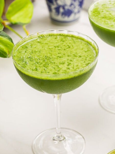 a matcha martini on a white counter