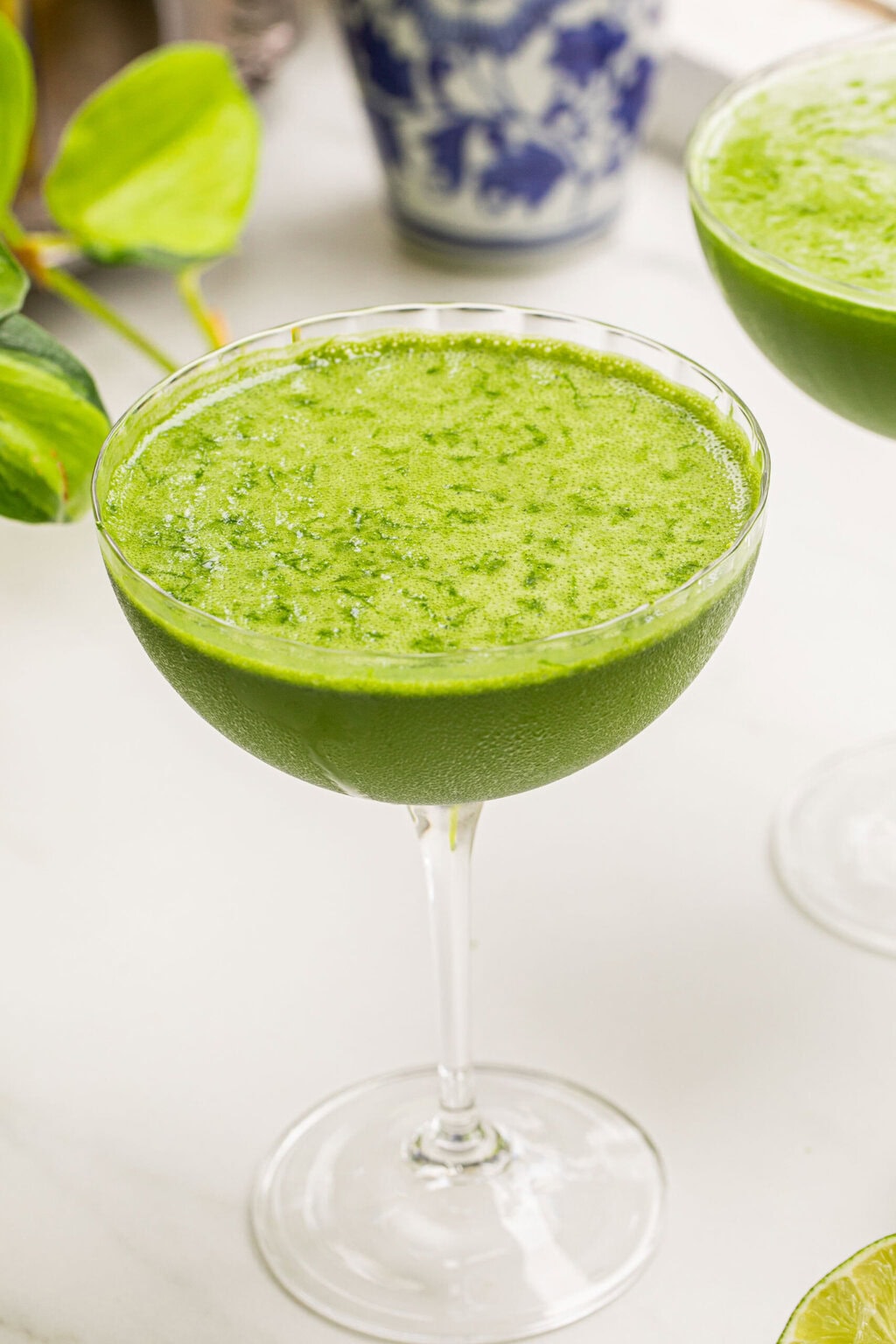 a matcha martini on a white counter