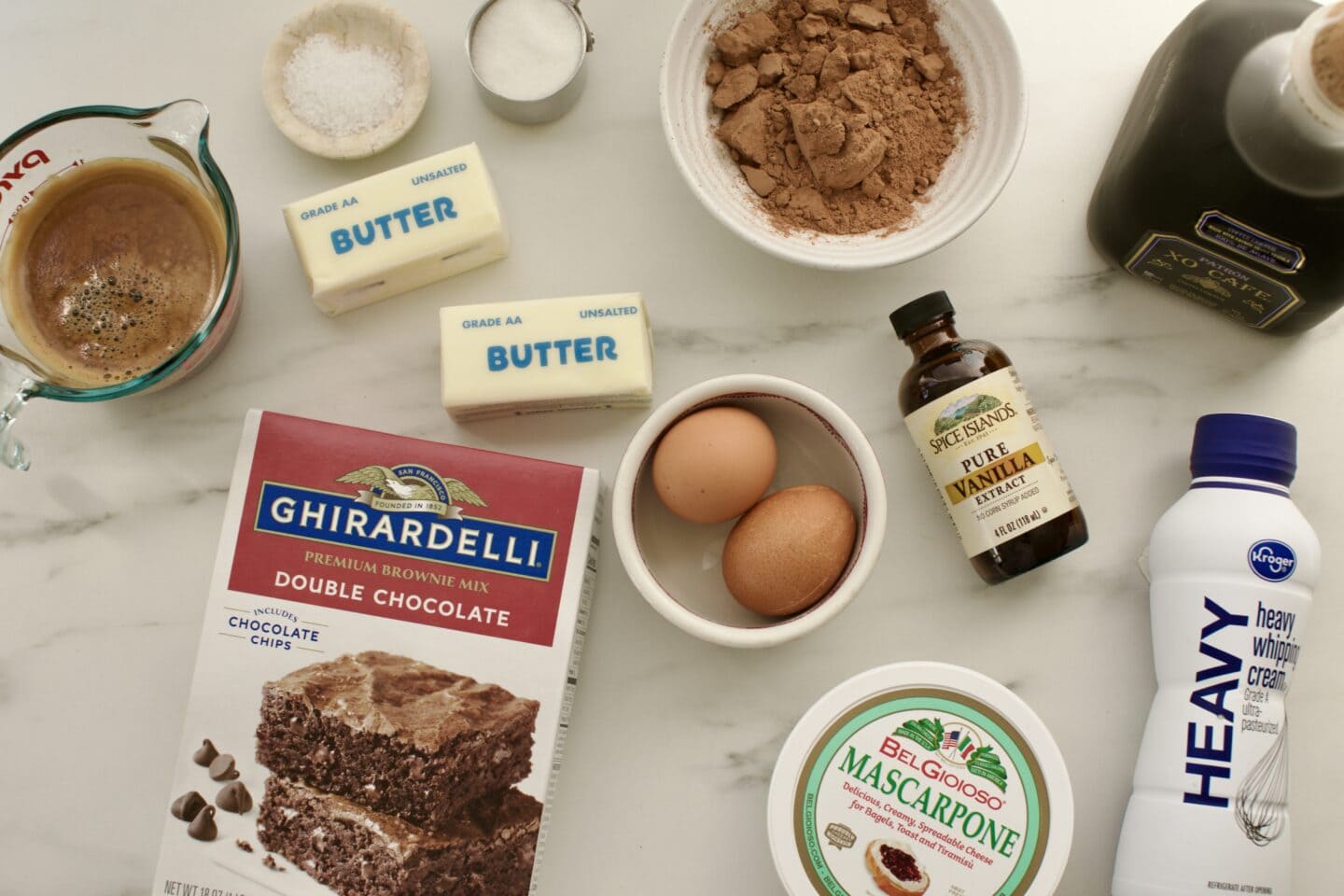 espresso, boxed brownie mix, butter, salt, sugar, cocoa powder, eggs, vanilla extract, mascarpone cheese, heavy whipping cream, and coffee liqueur